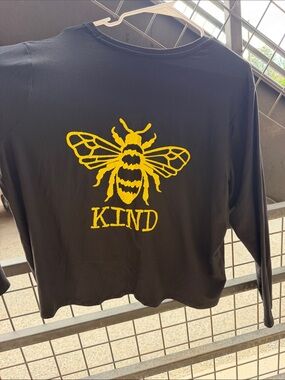 Woman’s Black Long-Sleeve Tee with Yellow Bee "KIND" Graphic